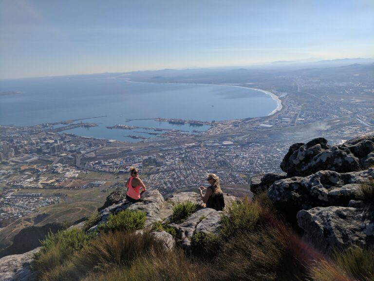 2 Girls Looking Down on Table Bay from on top of Table mountain