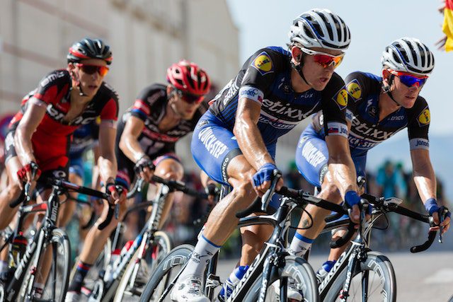 Men competing in a cycling event