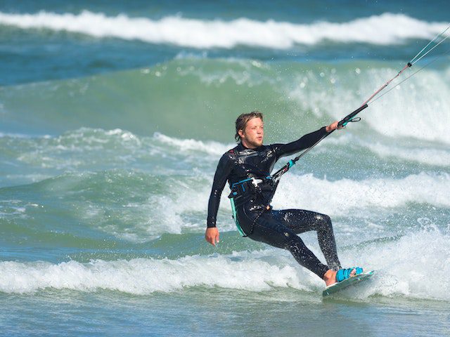 A Kiteboarder in the water looking tired