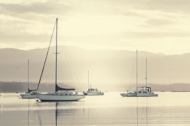 a few yachts on calm water